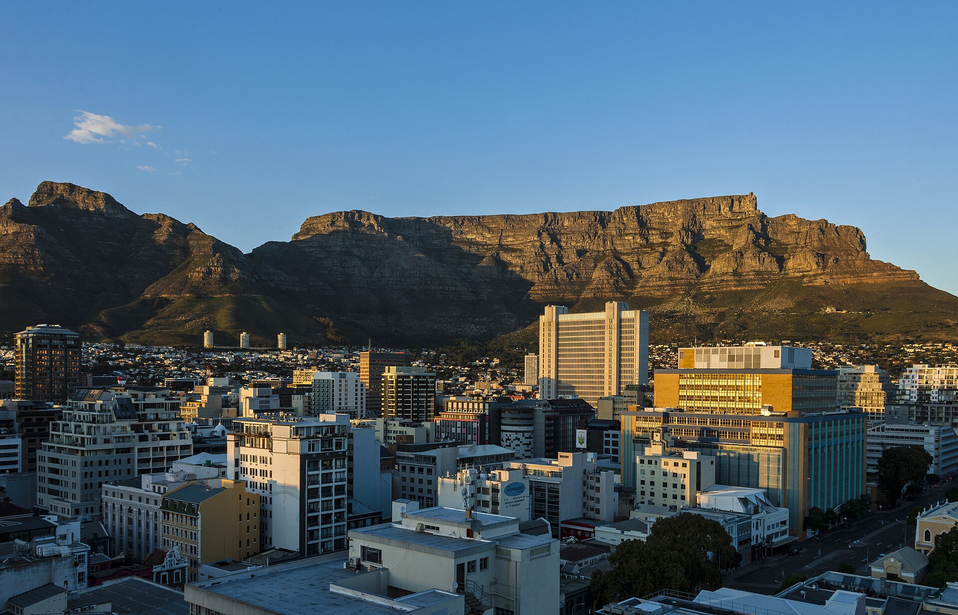 Table Mountain rising above the Cape Town City Bowl and harbour at dawn